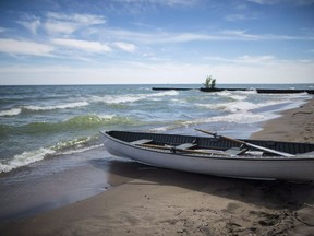 A lifeboat sits along the Gibraltar Point Beach on Toronto Island on Thursday, June 21, 2018. The City of Toronto has dropped plans for a formal event space near Hanlan's Point Beach in response to concerns it could jeopardize the LGBTQ space on Toronto Island Park.