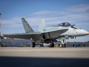 A CF-18 Hornet sits on the tarmac at Canadian Forces Base Trenton on Monday June 20, 2022. U.S. President Joe Biden's long-anticipated first trip to Ottawa this week is expected to put Canada's defence spending back under the microscope.THE CANADIAN PRESS/Lars Hagberg