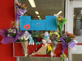 A memorial for 16-year-old Gabriel Magalhaes is shown at the Keele Street subway station in Toronto, Monday, March 27, 2023.&ampnbsp;The 22-year-old man accused of the stabbing death of a 16-year-old boy in a Toronto subway station is wanted on an outstanding warrant in Newfoundland.&ampnbsp;THE CANADIAN PRESS/Sharif Hassan