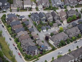 Houses and townhouses are seen in an aerial view, in Langley, B.C., on Wednesday May 16, 2018.