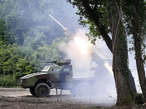 FILE - A Serbian army rocket launcher system fires missile during an exercise at Nikinci training ground, 60 kilometers west of Belgrade, Serbia, Tuesday, May 9, 2017. Russia is seeking an official explanation from its ally Serbia about reports that the Balkan country has delivered thousands of rockets to Ukraine for its fight against the Russian aggression.