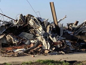 Debris covers a damaged structure in Rolling Fork, Miss,. on Saturday, March 25, 2023. Powerful tornadoes tore through the Deep South on Friday night, killing several people in Mississippi, obliterating dozens of buildings.