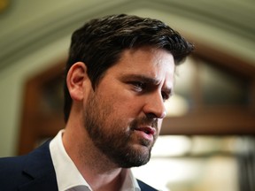Sean Fraser, Minister of Immigration, Refugees and Citizenship, arrives to a caucus meeting on Parliament Hill in Ottawa on Wednesday, March 22, 2023.