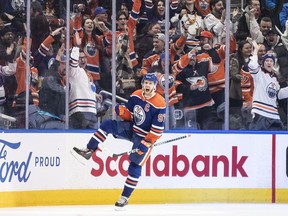Edmonton Oilers' Connor McDavid (97) celebrates his 300th career goal, against the Los Angeles Kings during third period NHL action in Edmonton on Thursday March 30, 2023.THE CANADIAN PRESS/Jason Franson