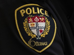 A close-up of an Ottawa Police officer's badge is seen in Ottawa, Thursday, April 28, 2022.&ampnbsp;Ottawa's Mayor has put out a statement after public backlash over photos of the Ottawa Police Service wearing a 'thin blue line' symbol on their hockey jerseys at a charity game on March 10.