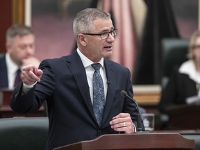 Alberta Finance Minister Travis Toews delivers the budget, in Edmonton, Tuesday, Feb. 28, 2023. Toews says he will not run in the upcoming provincial election.