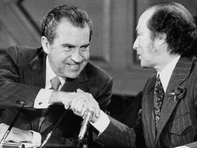 President RIchard Nixon and Prime Minister Trudeau smile as they shake hands after signing a five-year agreement to clean up the Great Lakes April 15, 1972.