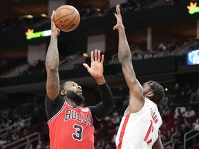 Chicago Bulls center Andre Drummond (3) shoots as Tari Eason defends during the second half of an NBA basketball game, Saturday, March 11, 2023, in Houston.