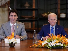 Canada's Prime Minister Justin Trudeau and U.S. President Joe Biden attend an emergency meeting of global leaders after an alleged Russian missile blast in Poland, in Bali, Indonesia, Nov. 16, 2022.