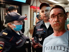 Andrey Chernyshov shows the moment he says he was detained by police officers whilst travelling on a metro train in Moscow, Russia, June 2022.