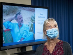 FILE - Els Woodke speaks about the 2016 kidnapping of her husband Jeffrey Woodke, photo on video monitor, in West Africa, during a news conference in Washington, Nov. 17, 2021. The Biden administration says the American aid worker who was kidnapped in Niger six years ago has been released from custody. Jeffrey Woodke was kidnapped from his home in Abalak, Niger, in October 2016 by men who ambushed and killed his guards and forced him at gunpoint into their truck, where he was driven north toward Mali's border.