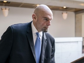FILE - Sen. John Fetterman, D-Pa., leaves an intelligence briefing on the unknown aerial objects the U.S. military shot down this weekend at the Capitol in Washington, Feb. 14, 2023. Fetterman's office expects him to return soon to the chamber, although Democratic leaders are giving no timeline five weeks after he sought inpatient treatment for clinical depression.