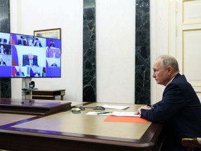 Russian President Vladimir Putin chairs a Security Council meeting via videoconference in Moscow, Russia, Friday, March 24, 2023.