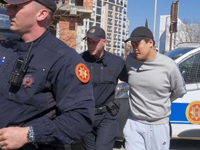 Montenegrin police officers escort an individual who is believed to be one of the most wanted fugitives, South Korean citizen, Terraform Labs founder Do Kwon in Montenegro's capital Podgorica, Friday, March 24, 2023. South Korea's Justice Ministry on Friday confirmed the arrest of Kwon and another unidentified individual linked to the cryptocurrency crash and said it will proceed with steps to extradite them to South Korea. Both South Korea and Montenegro are signees to the European Convention on Extradition.