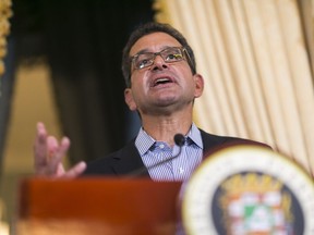 FILE - Puerto Rico's Gov. Pedro Pierluisi speaks during a press conference at La Fortaleza in San Juan, Puerto Rico, Aug. 6, 2019. Pierluisi announced new solar energy initiatives on Tuesday, March 28, 2023, during his annual state of the territory address, a speech viewed by many as critical as he fights plummeting ratings amid growing discontent over costly electric bills, government corruption and slow-moving hurricane reconstruction.