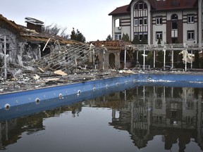 A damaged restaurant is seen after Russian shelling hit in Zaporizhzhia, Ukraine, Saturday, March 18, 2023.