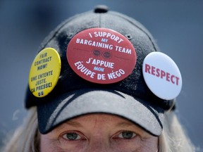 Striking PSAC worker Sue Groult wears her heart on her head while picketing in Ottawa Friday.