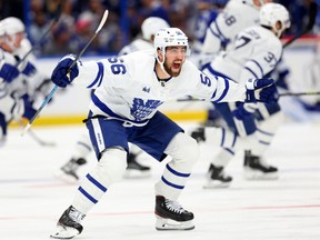 Erik Gustafsson #56 of the Toronto Maple Leafs celebrate winning Game Six of the First Round of the 2023 Stanley Cup Playoffs on an overtime goal by John Tavares #91 against the Tampa Bay Lightning at Amalie Arena on April 29, 2023 in Tampa, Florida.