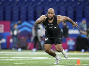 Eastern Michigan offensive lineman Sidy Sow runs a drill at the NFL football scouting combine in Indianapolis, Sunday, March 5, 2023.