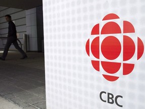 A man leaves the CBC building in Toronto on Wednesday, April 4, 2012. One of CBC's Twitter accounts now has a label which describes the broadcaster as "Government-funded Media.''