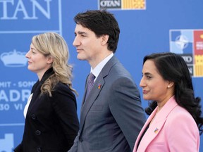 Canadian Minister for Foreign Affairs Melanie Joly, Canada's Prime Minister Justin Trudeau and Canada's Minister of Defence Anita Anand arrive for the NATO summit at the Ifema congress centre in Madrid, on June 30, 2022. Photo by Eliot Blondet/ABACAPRESS.COM