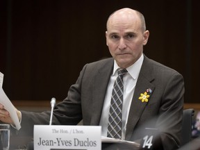 Minister of Health Jean-Yves Duclos looks around the room as he waits to appear at the Health committee, Thursday, April 27, 2023 in Ottawa. Duclos says he has not exercised any undue political pressure on the independent federal agency that regulates the price of patented drugs on its efforts to lower medicine costs.
