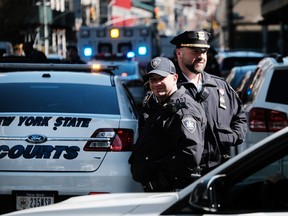 NEW YORK, NY - APRIL 03: Police gather outside of the Manhattan Criminal Courthouse on April 03, 2023 in New York City.