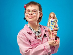 French City Counsellor & Author Eleonore Laloux holds the new Barbie doll with Down's syndrome, in Paris, France April 19, 2023.