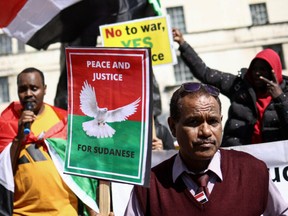People gather near Downing Street to protest against the conflict in Sudan, in London, Britain April 29, 2023.