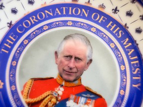 LONDON, ENGLAND - APRIL 29: In this photo illustration, a souvenir collectible plate marking the Coronation of King Charles III is seen on April 29, 2023 in London, England.