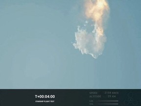 An image from a SpaceX video shows the Starship exploding after launch after failing to separate from its booster.