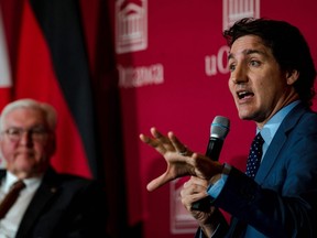 Justin Trudeau speaks during a meeting Monday with University of Ottawa students as German President Frank-Walter Steinmeier looks on.