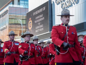 Police and peace officers march through Edmonton last week for the regimental funeral of Edmonton Police Service constables Travis Jordan and Brett Ryan, who were killed in the line of duty.