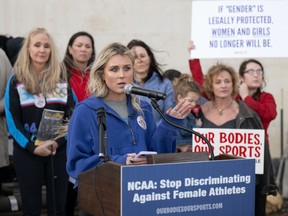 Former University of Kentucky swimmer Riley Gaines speaks at the “Tell the NCAA: Stop Discriminating Against Female Athletes” rally on Thursday, Jan. 12, 2023, outside of the NCAA Convention in San Antonio. (AP Photo/Darren Abate)