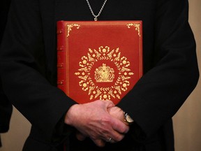 Archbishop of Canterbury Justin Welby holds the Coronation Bible, a specially commissioned Bible which will be used when King Charles III takes the Coronation Oath.
