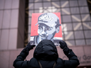 A demonstrator holds up a portrait of Daunte Wright outside the Hennepin County Government Center during the sentencing hearing for former Brooklyn Center police officer Kim Potter on February 18, 2022 in Minneapolis, Minnesota.