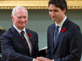 Justin Trudeau shakes hands with then governor general David Johnston after being sworn in as prime minister on Nov. 4, 2015. Columnist Rex Murphy questions both Trudeau's selection of Johnston to investigate Chinese interference in Canadian elections, and the Liberals' efforts to diminish Alberta's oil and gas industry.