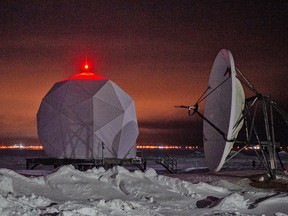A Norad radar dome is illuminated at the Point Barrow Long Range Radar Site in Alaska, February 3, 2023.