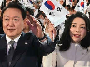 South Korean President Yoon Suk-yeol and his wife Kim Keon-hee give three cheers during the 104th Independence Movement Day ceremony on March 01, 2023 in Seoul, South Korea.