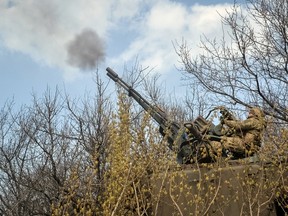 Ukrainian troops fire a military vehicle with anti-aircraft cannon, as Russia's attack on Ukraine continues, near the front line city of Bakhmut, Ukraine April 7, 2023.