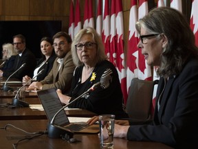 Physicist Ginette Charbonneau, NDP MP Alexandre Boulerice, Liberal MP Jenica Atwin, Bloc Quebecois MP Mario Simard and Green Party MP Elizabeth May listen to Coalition for Responsible Energy Development in New Brunswick's Susan O'Donnell speak during a news conference in Ottawa, Tuesday, April 25, 2023.
