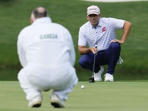 Sergio Garcia, of Spain, lines up a putt on the fourth hole during the par 3 contest at the Masters golf tournament at Augusta National Golf Club on Wednesday, April 5, 2023, in Augusta, Ga. Garcia's shirt displays his LIV team logo.