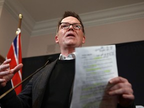 B.C. Liberal Leader Kevin Falcon reacts to the budget speech during a press conference at the legislature in Victoria, B.C., on Tuesday, February 28, 2023.