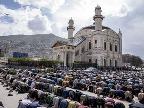 FILE - Afghan worshippers attend Friday prayer during the Muslim holy fasting month of Ramadan, in Kabul, Afghanistan, Friday, March 31, 2023. A women-run radio station in Afghanistan's northeast has been shut down for playing songs and music during the holy month of Ramadan, a Taliban official said Saturday, April 1.