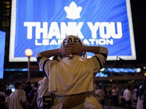 Toronto Maple Leafs fans react after game 7 of NHL playoff hockey against the Tampa Bay Lightning, in Toronto, Saturday, May 14, 2022. Toronto Maple Leafs fans are expected to gather at Maple Leaf Square in downtown Toronto tonight, as the team tries to advance to the second round of the playoffs for the first time since 2004.