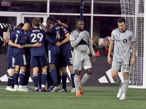 CF Montreal defenders, including Aaron Herrera (22), walk away as New England Revolution players celebrate after Giacomo Vrioni goal in the second half of an MLS soccer match against Saturday, April 8, 2023, in Foxborough, Mass. CF Montreal off to their worst start ever in Major League Soccer, ahead of a three-game homestand, beginning Saturday against D.C. United.