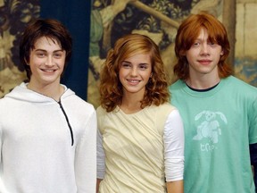 Daniel Radcliffe, Emma Watson and Rupert Grint pose at a photocall at London's Liberal Club 27 May, 2004.