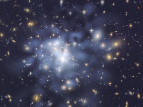 A Hubble Space Telescope image shows the distribution of dark matter in the center of the giant galaxy cluster Abell 1689, containing about 1,000 galaxies and trillions of stars, using gravitational lensing.