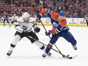 Los Angeles Kings' Vladislav Gavrikov (84) tries to stop Edmonton Oilers' Connor McDavid (97) during second period NHL Stanley Cup first round playoff action in Edmonton on Monday April 17, 2023.History repeating itself is the next goal for the Edmonton Oilers.