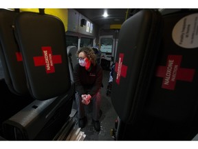 Naloxone kits hang from the ceiling of the City Centre Team Community Paramedic Unit as Paramedic Elaine Hutchings poses for a photo in Edmonton on Monday, Jan. 24, 2022.